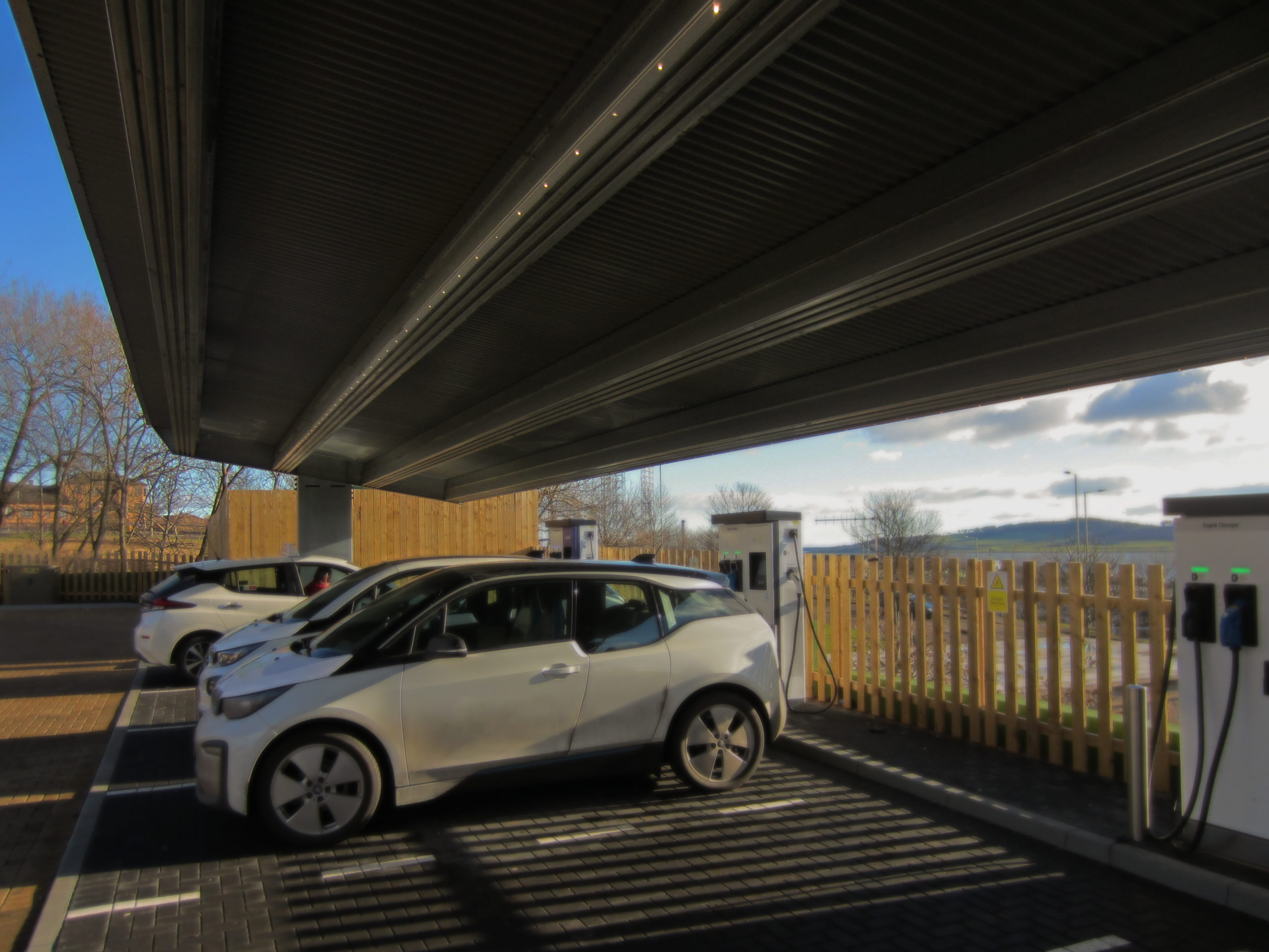 Solar carport, charging station and car park illuminated by linear led panel